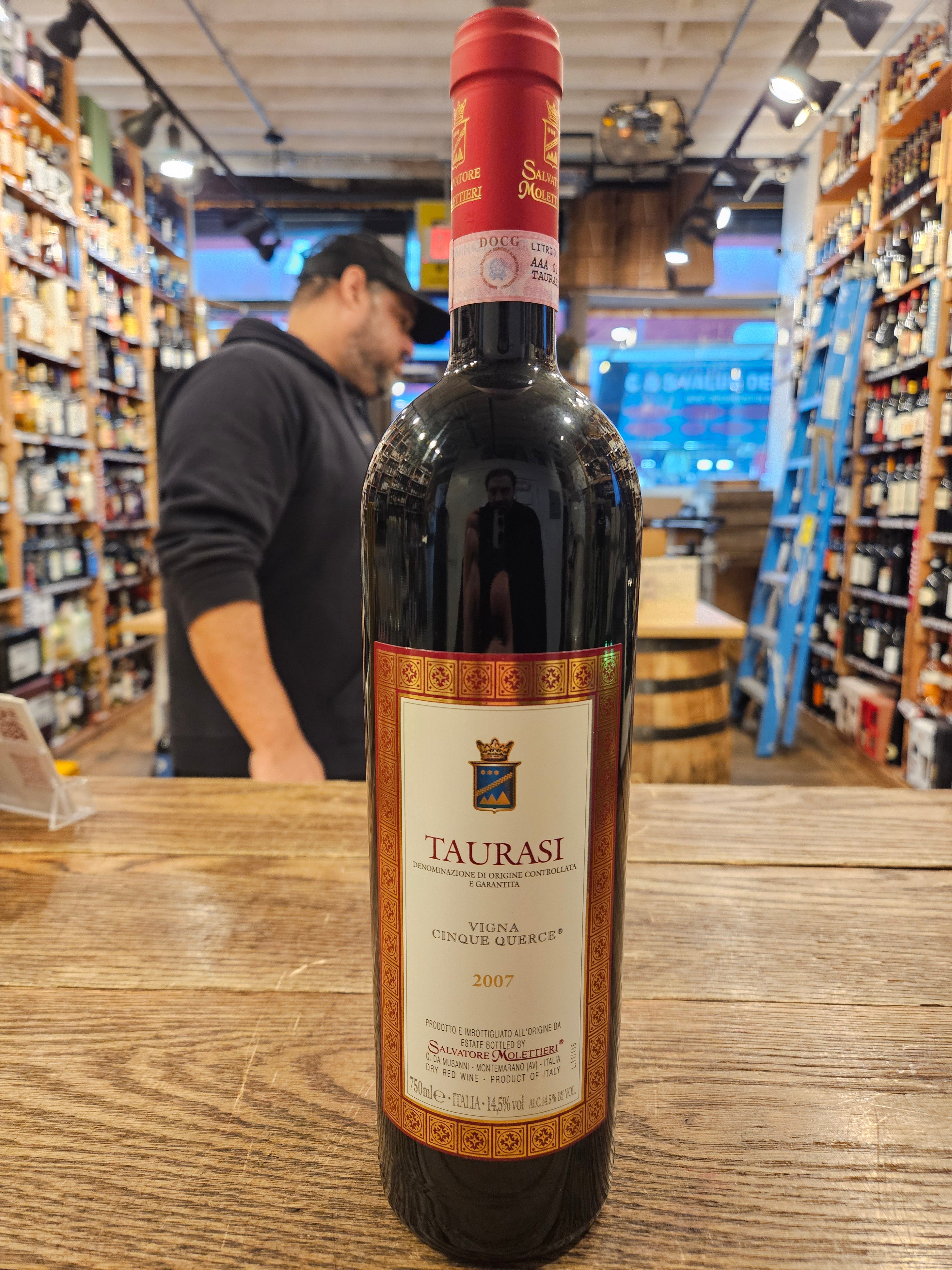 Taurasi Vigna Cinque Querce 750mL tall slim dark wine bottle with a red and white label and red top