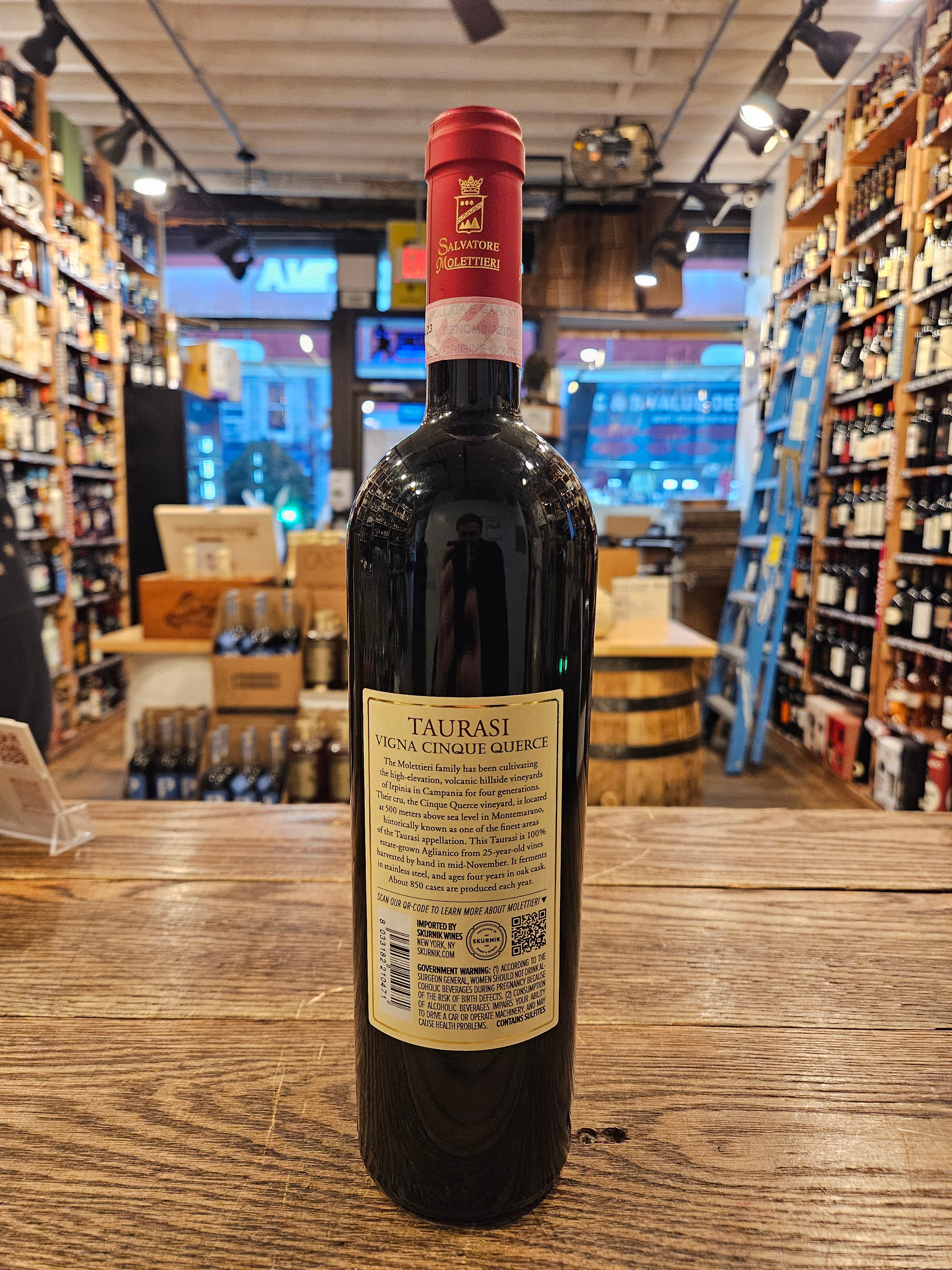 Taurasi Vigna Cinque Querce 750mL backside of tall slim dark wine bottle with a red and white label and red top