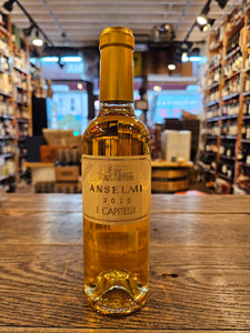 Anselmi i Capitelli 375mL a small clear glass wine bottle with a gold and beige label and golden top