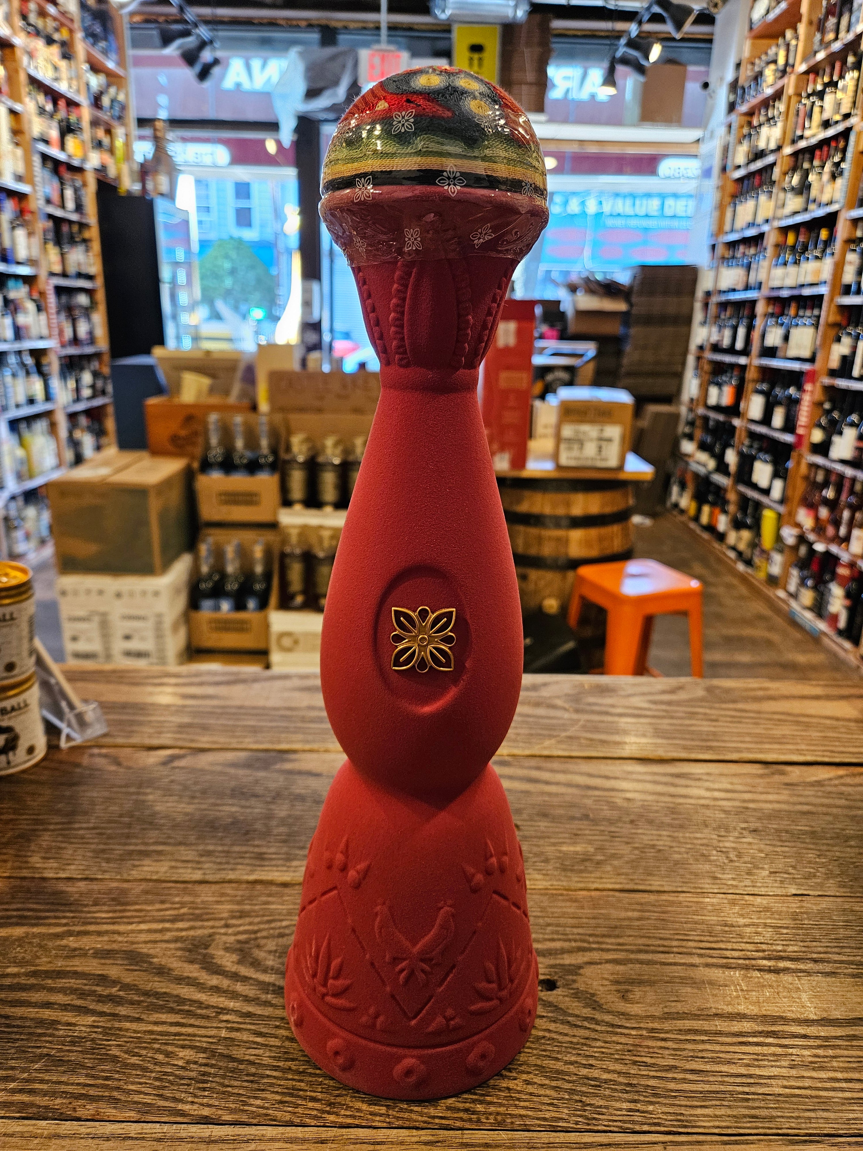 Clase Azul Mezcal San Luis Potosí 750mL a handmade red elegantly shaped ceramic bottle with a colorful bell top