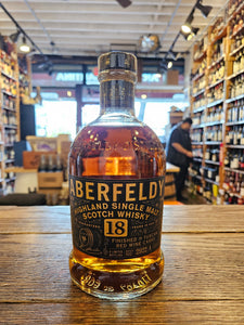 Aberfeldy Highland Single Malt Scotch Whisky 18yr 750mL a short squat round shouldered clear glass bottle with a black label and a black top