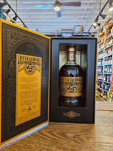Aberfeldy Highland Single Malt Scotch Whisky 25yr Sherry Cask Finish 750mL an open black and gold box with a short squat rounded clear glass bottle inside with a gold and black label and golden top