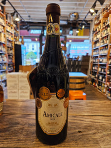 Amicale 750ml a dark glass wine bottle with a beige label and a maroon top