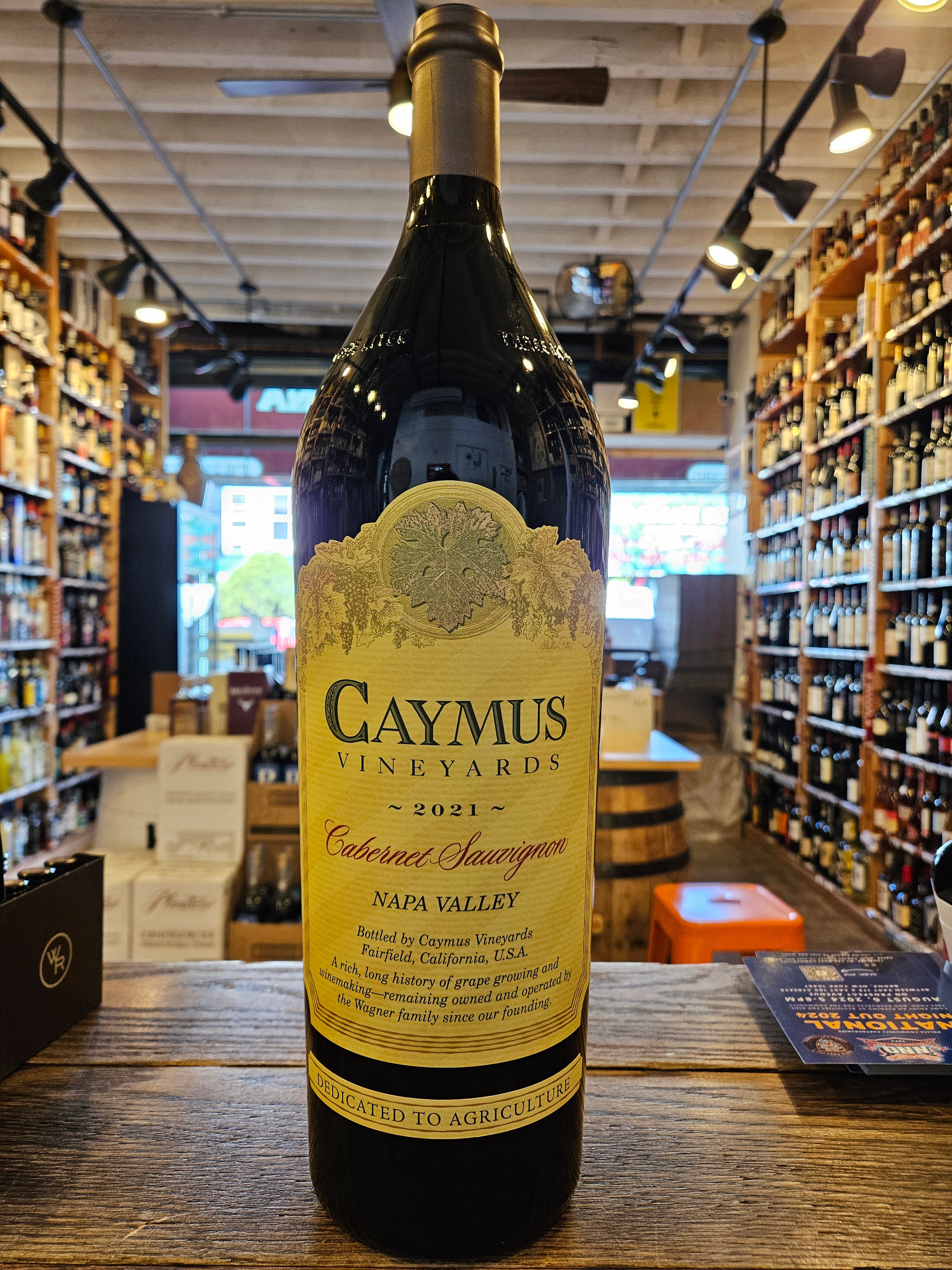 Caymus Cabernet Napa 2021 3L a large robust high shouldered dark glass wine bottle with a beige label and black top