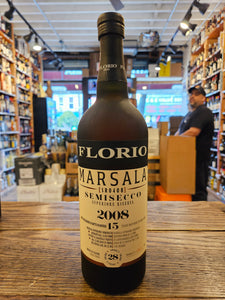 Florio Marsala Superiore Riserva Semisecco 750mL a dark frosted glass bottle with a large beige label and a black top.