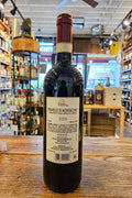 Castello Romitorio Brunello di Montalcino 2013 750mL dark glass wine bottle with a colorful label and maroon top