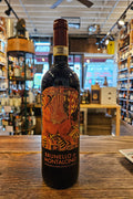 Castello Romitorio Brunello di Montalcino 2015 750mL dark glass wine bottle with a colorful label and maroon top