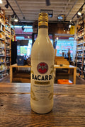 Bacardi Coquito 750mL a white glass bottle with gold and black lettering with a gold top