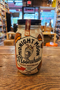Midnight Moon Peanut Butter Cup Moonshake 750mL a glass jar with a white label and black top