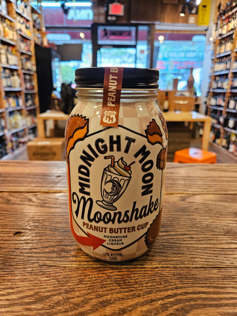 Midnight Moon Peanut Butter Cup Moonshake 750mL a glass jar with a white label and black top