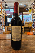 Planeta La Segreta Nero D'Avola 750mL a dark glass wine bottle with a white label and red top
