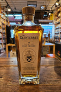 Glenturret 7 Year Peat Smoked 750mL a heavy squared clear glass bottle with a cork top and a white label