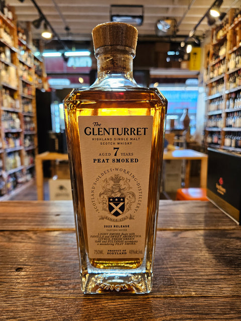 Glenturret 7 Year Peat Smoked 750mL a heavy squared clear glass bottle with a cork top and a white label