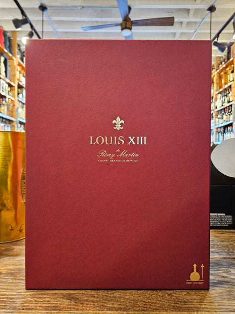 Louis XIII 750mL a deep red rectangular box with gold lettering on the front. 