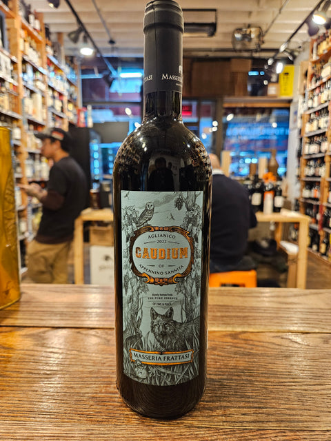 Masseria Frattasi Caudium Aglianico Beneventano 750mL a dark glass bottle with a large blue label and black top