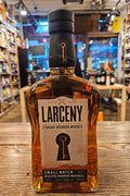 Larceny Small Batch 750mL a flat surfaced clear glass bottle with a beige label and a black top