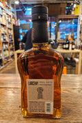 Larceny Small Batch 750mL a flat surfaced clear glass bottle with a beige label and a black top
