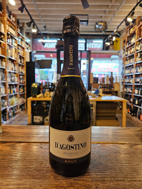 D'Agostino Prosecco 750mL a champagne shaped glass dark bottle with a white label and black top