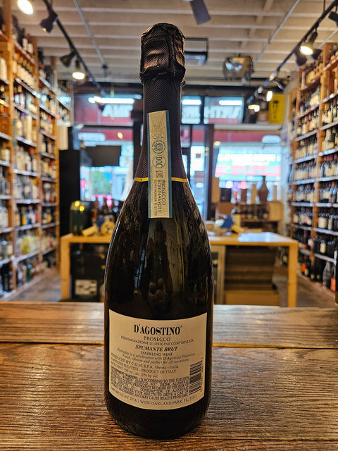 D'Agostino Prosecco 750mL a champagne shaped glass dark bottle with a white label and black top