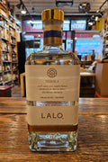 Lalo Tequila High Proof 750mL a squared clear glass bottle with a white label and a golden top
