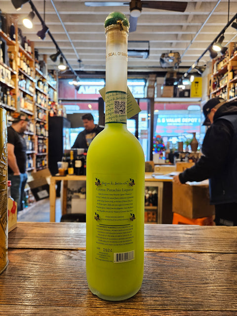 Sogno Di Sorrento Crema di Pistacchio 750mL a tall long necked frosted clear bottle with pistachios on the label with a green top