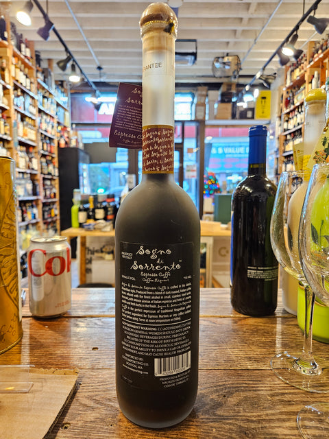 Sogno Di Sorrento Crema Espresso Caffè 750mL a tall slender necked frosted bottle with white lettering and a wooden topper.