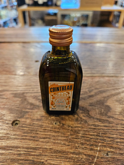 Cointreau 50mL small squared dark glass bottle with a white label and a copper top