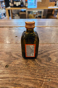 Cointreau 50mL small squared dark glass bottle with a white label and a copper top