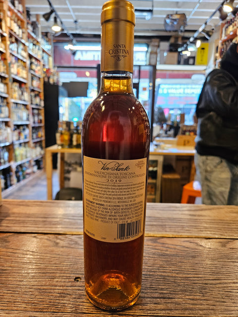 Vin Santo Santa Cristina Valdichiana 375mL 2019 a short clear glass bottle with a beige label and a golden top