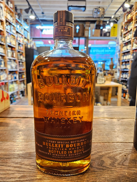 Bulleit Bottled in Bond Kentucky Straight Bourbon 750mL round shouldered clear glass bottle with a brown label and black topper