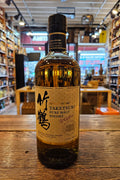 Nikka Taketsuru Pure Malt Whisky 750mL a stubbed neck brown glass bottle with a beige label and black top