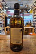 Nikka Taketsuru Pure Malt Whisky 750mL a stubbed neck brown glass bottle with a beige label and black top