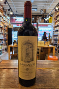 Tenuta di Arceno Arcanum 2018 750mL a dark glass wine bottle with a white label and a red top