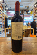 Tenuta di Arceno Arcanum 2018 750mL a dark glass wine bottle with a white label and a red top