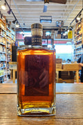 Orphan Barrel Fanged Pursuit 17 Year Kentucky Straight Bourbon Whiskey 750mL a squared clear glass bottle with a dark label and wooden top