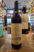 Le Difese 2022 Tenuta San Guido 750mL a dark glass wine bottle with a beige label and a dark blue top