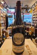 Bertani Amarone della Valpolicella Classico 2012 750mL a dark glass wine bottle with a beige label and maroon top