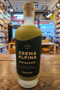 Crema Alpina Pistachio Cream 700mL a frosted clear glass bottle with a green label and wooden top