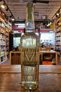 Dulce Vida Organic Tequila Reposado 750mL a tall clear glass bottle with a white and green label and wooden topper