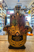 Casa De Hamsa Anejo Tequila 1L a hand shaped ceramic bottle decorated black and gold with a wooden top
