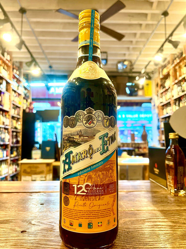 Amaro dell Etna Riserva 120th Anniversary tall bottle with white blue and yellow label
