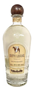 Siete Leguas Reposado 1L a robust high round shouldered clear glass bottle with a gold label and a round wooden top