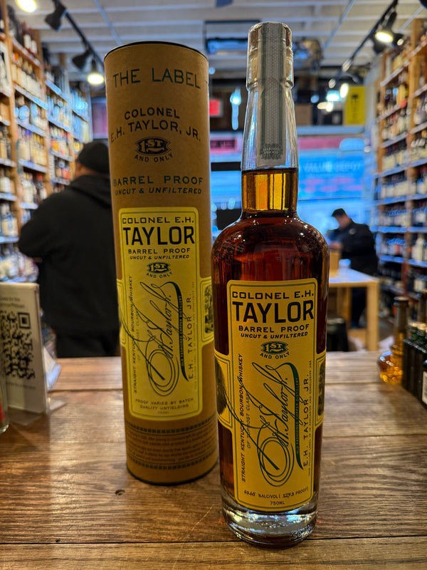 Tall clear bottle with yellow label