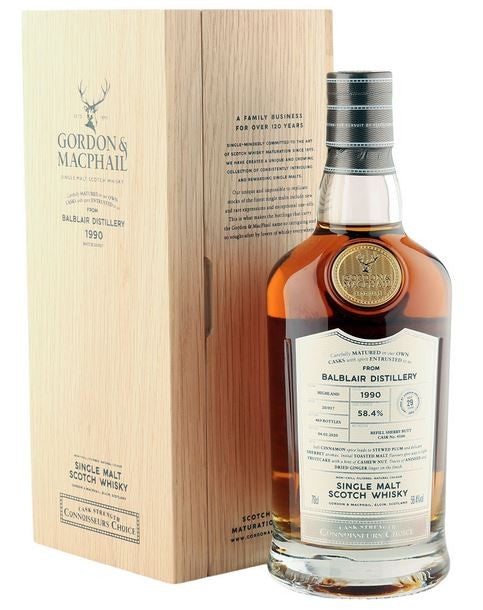 Gordon & Macphail Balblair Distillery 29 Year Connoisseurs Choice Cask Strength Single Malt Scotch 1990 Batch 20/017 750ml a tall wooden box with black lettering next to a stout round shouldered clear bottle with a white label and black top