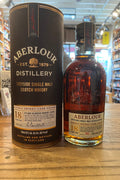 Short fat bottle with beige label with red lettering that says Aberlour Double sherry cask finish, gold lettering that says 18 years old, and it's round brown gift tin that reads Aberlour Double sherry cask finish