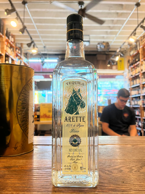 Arette Tequila Blanco with green label with horse head 