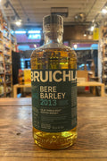 Bruichladdich Bere Barley cylindrical bottle with dark green label and white text