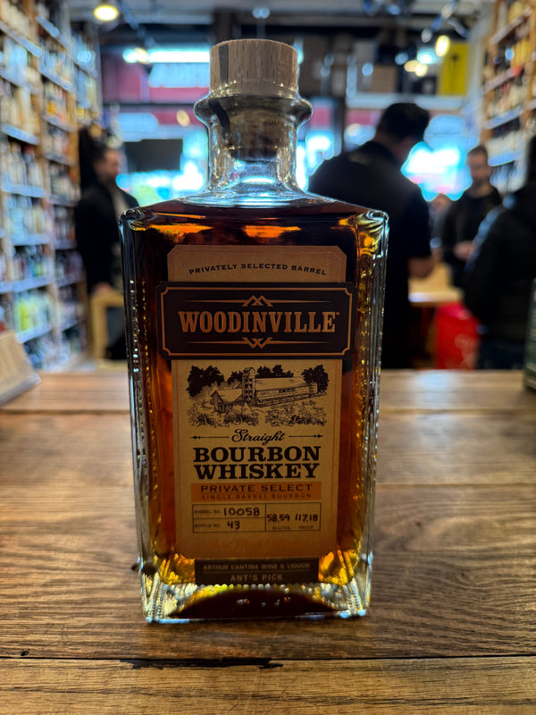 Woodinville Bourbon Store Pick Barrel 10058 750mL a squared clear glass bottle with a brown label and wooden top