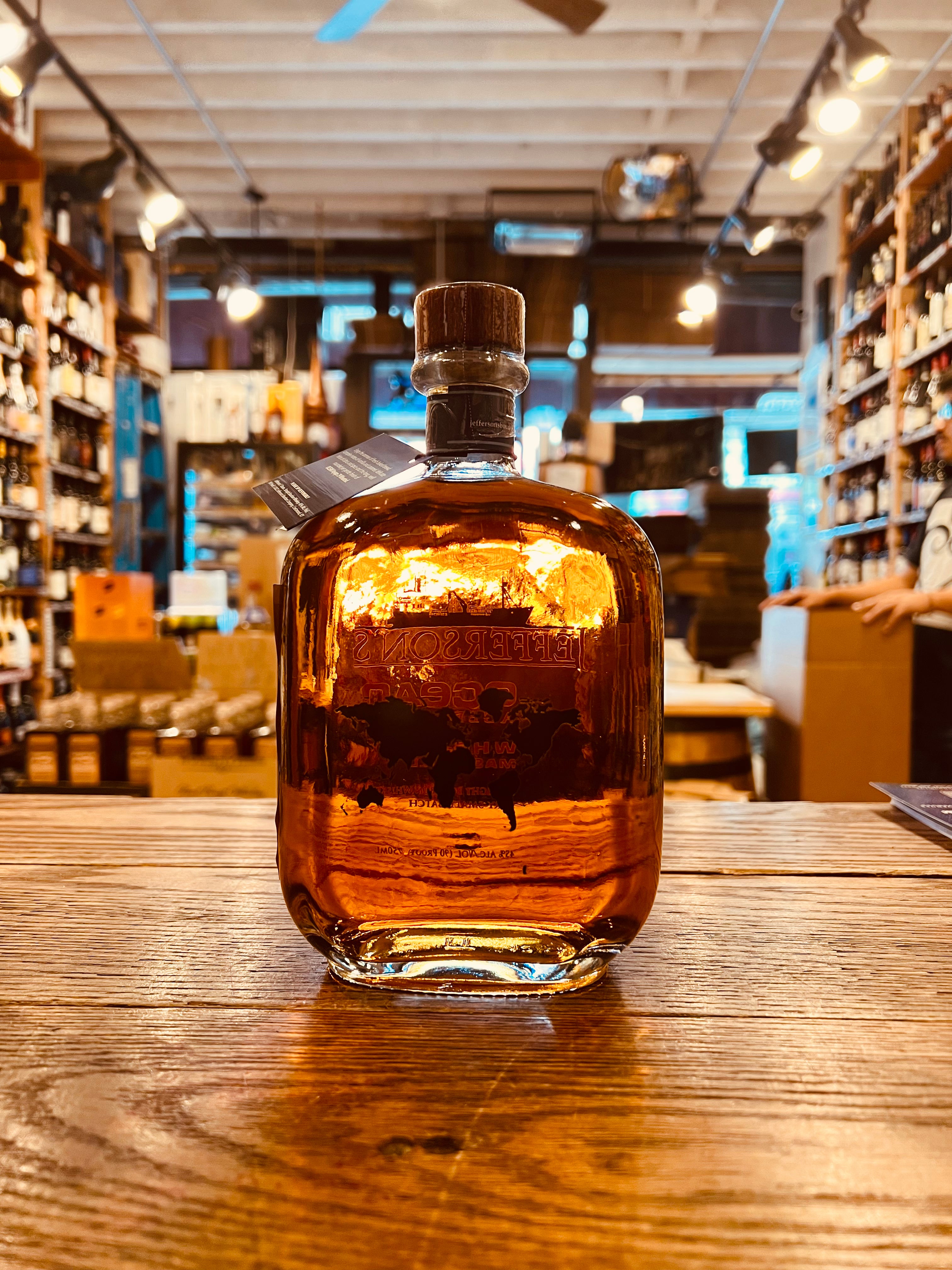 Jefferson's Ocean Aged At Sea Wheated Bourbon 750mL Voyage 29 the backside of a clear short square rounded bottle with gold lettering and a wooden top