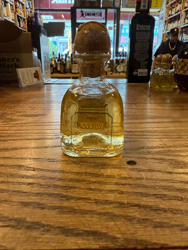 Patron Anejo 100mL clear bottle with cork on top.
